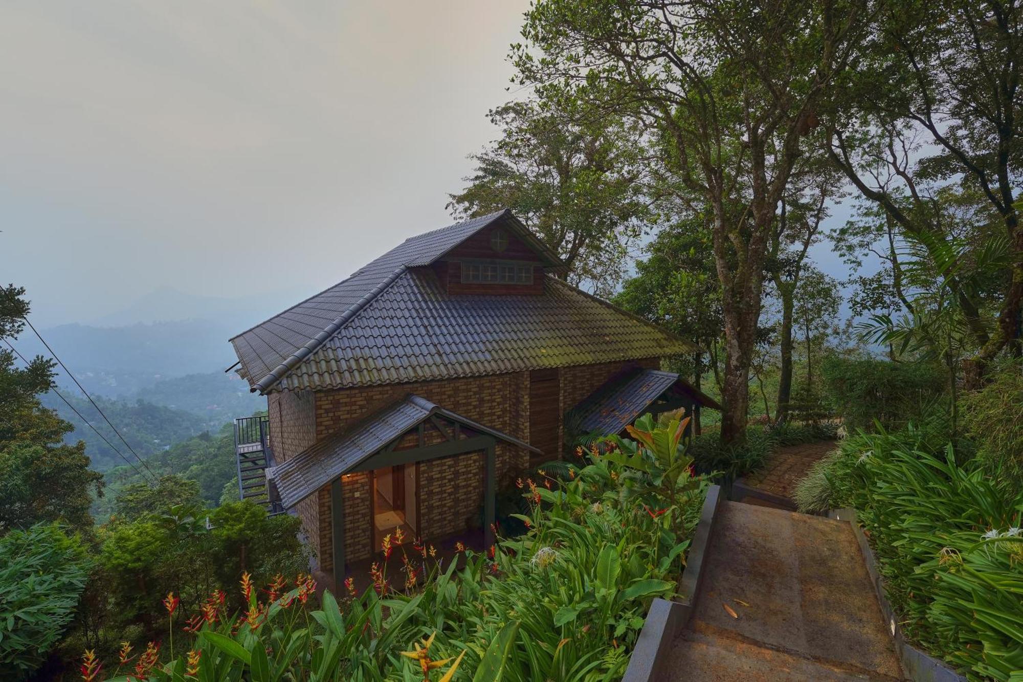 Elephant Passage Munnar Eksteriør bilde A cottage at the resort
